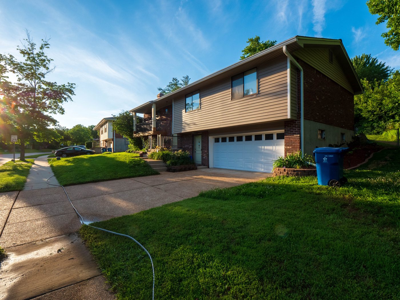 Driveway and walkway after professional concrete cleaning, South County St. Louis